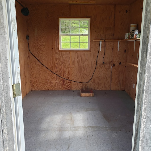 349 Treva Ln, Monterey, TN 38574 - basement with tile patterned floors and wooden walls