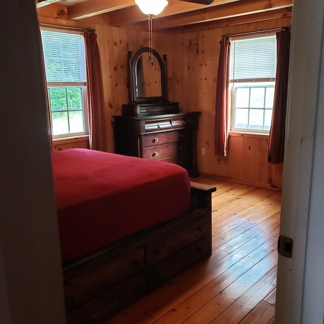 349 Treva Ln, Monterey, TN 38574 - bedroom with light wood finished floors, wooden walls, and beamed ceiling