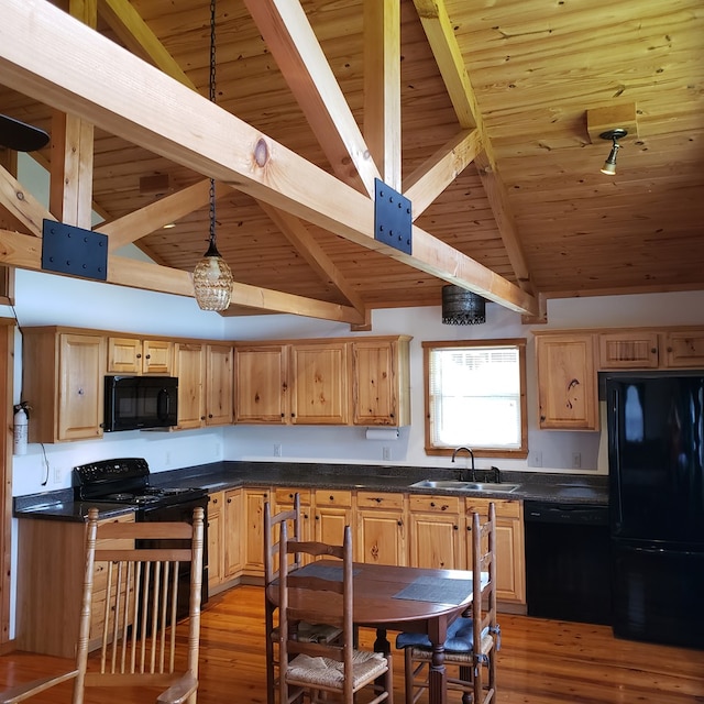 349 Treva Ln, Monterey, TN 38574 - kitchen with black appliances, light wood finished floors, dark countertops, wooden ceiling, and light brown cabinets