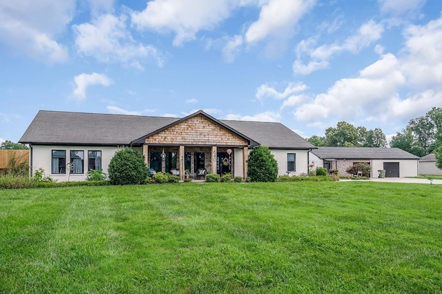 view of front of house with a garage and a front yard