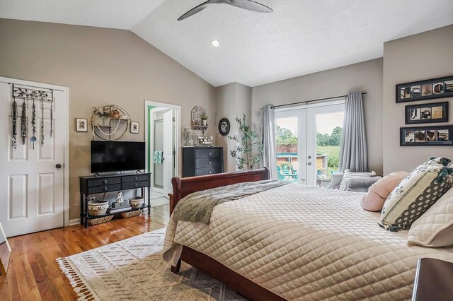 bedroom featuring lofted ceiling, ceiling fan, wood finished floors, access to outside, and french doors