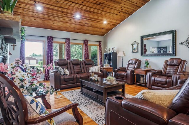 living area featuring vaulted ceiling, recessed lighting, wood ceiling, and light wood-style floors