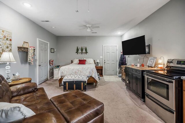 bedroom featuring light carpet, visible vents, and recessed lighting