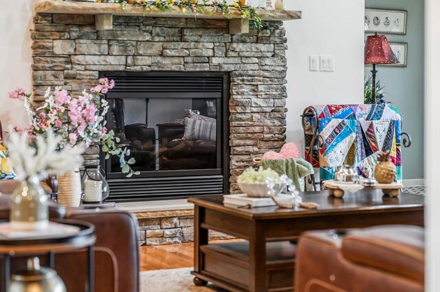 details with a fireplace and wood finished floors