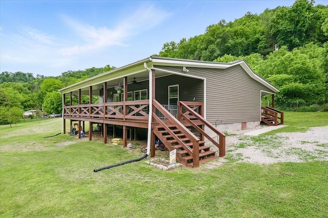 3569 Dry Mill Creek Rd, Hilham, TN 38568 - rear view of house with ceiling fan, stairs, a lawn, and a deck