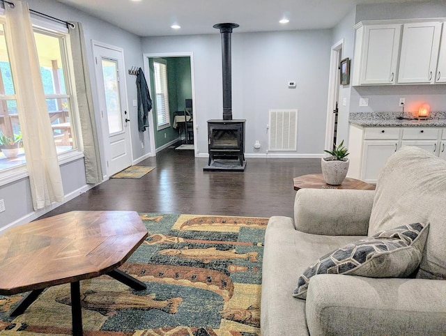 3569 Dry Mill Creek Rd, Hilham, TN 38568 - living room featuring a wood stove, recessed lighting, and dark wood-style flooring