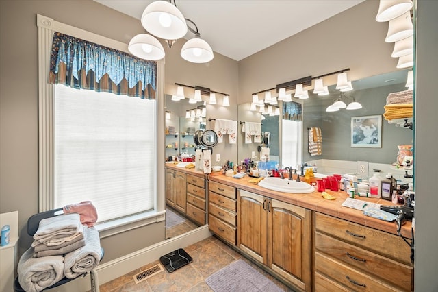 292 Mclerran Cemetery Rd, Moss, TN 38575 - full bathroom featuring healthy amount of natural light, vanity, and stone finish floors