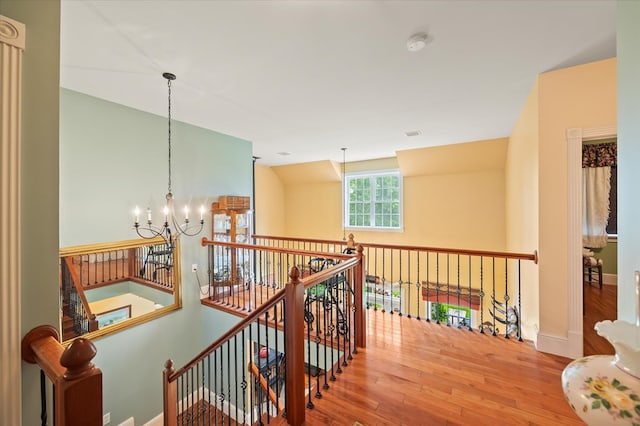 292 Mclerran Cemetery Rd, Moss, TN 38575 - hallway with a chandelier, wood finished floors, and an upstairs landing