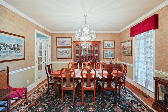 292 Mclerran Cemetery Rd, Moss, TN 38575 - dining space featuring wood finished floors, a chandelier, french doors, crown molding, and wallpapered walls