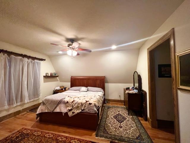 bedroom featuring ceiling fan and light wood-type flooring