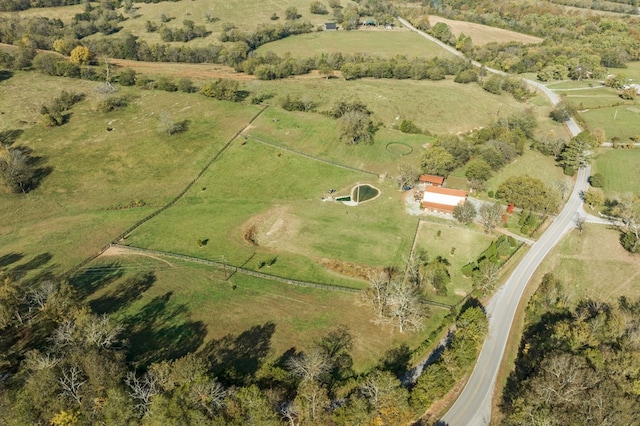 birds eye view of property with a rural view