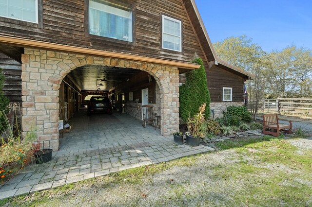 exterior space with stone siding