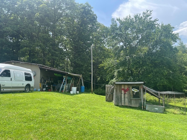 239 Doc Huling Rd, Robbins, TN 37852 - view of green lawn with an outdoor structure