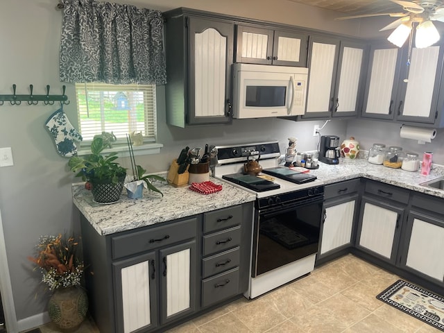 239 Doc Huling Rd, Robbins, TN 37852 - kitchen featuring white appliances, a ceiling fan, light tile patterned floors, and gray cabinetry