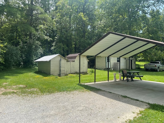 239 Doc Huling Rd, Robbins, TN 37852 - view of parking / parking lot featuring a storage unit and a detached carport