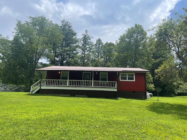 239 Doc Huling Rd, Robbins, TN 37852 - view of front of property with a front lawn, crawl space, covered porch, and a metal roof