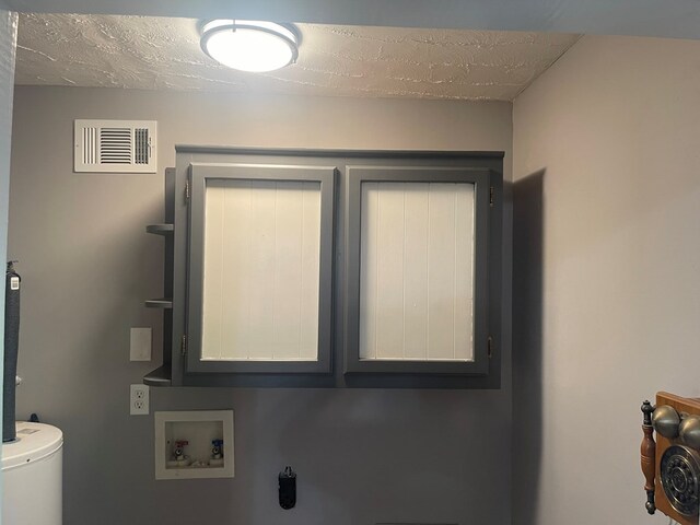 239 Doc Huling Rd, Robbins, TN 37852 - laundry area featuring hookup for a washing machine and cabinet space