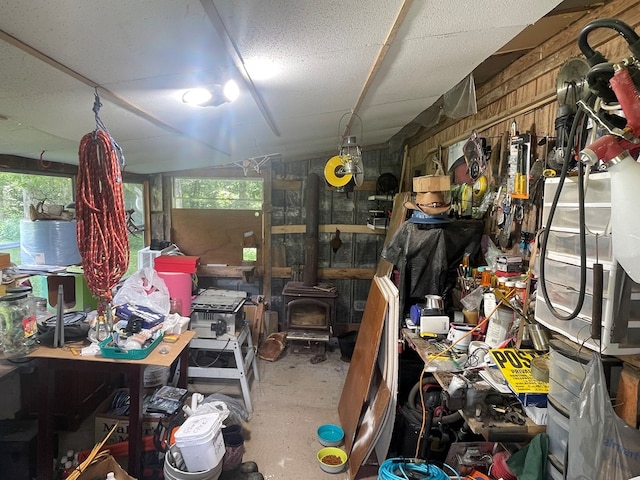 239 Doc Huling Rd, Robbins, TN 37852 - misc room featuring a wood stove, a workshop area, and healthy amount of natural light