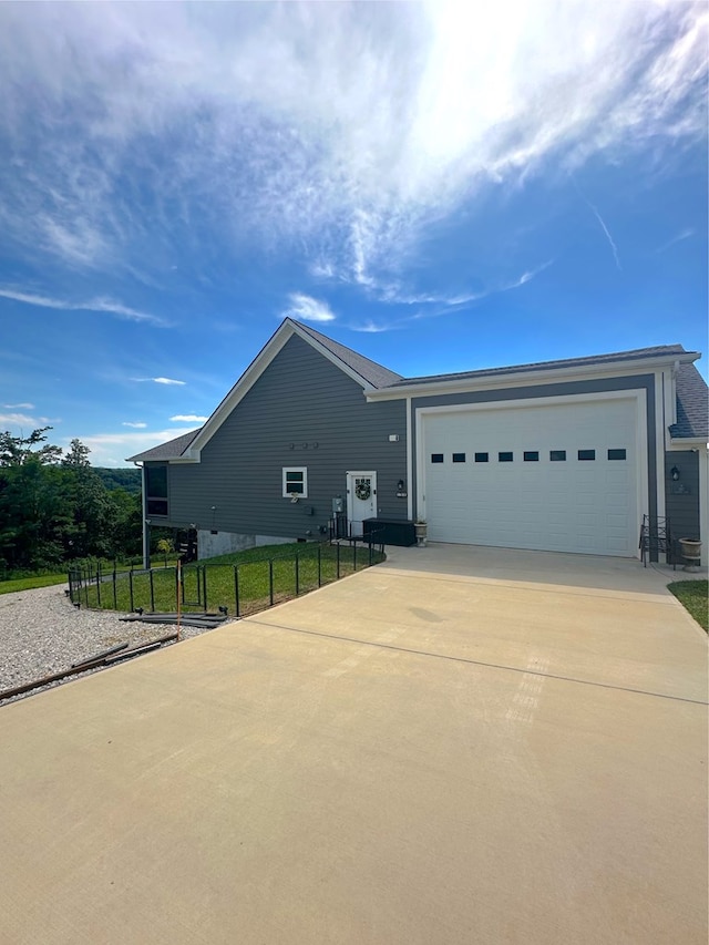 197 Sunfish Ln, Hilham, TN 38568 - view of property exterior with driveway and a garage
