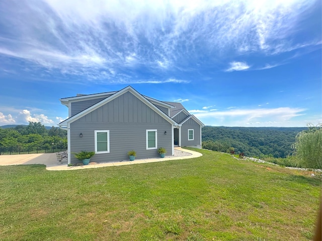 197 Sunfish Ln, Hilham, TN 38568 - view of side of property with board and batten siding and a lawn