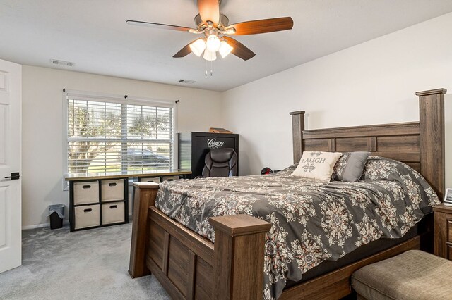 bedroom featuring light carpet, ceiling fan, and visible vents