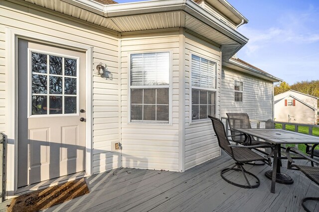 deck with outdoor dining area