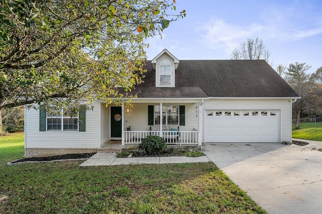 view of front of house featuring a porch, concrete driveway, a front lawn, and a garage