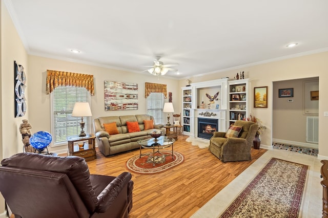 169 Prosperity Dr, Baxter, TN 38544 - living area featuring ceiling fan, a lit fireplace, crown molding, baseboards, and recessed lighting