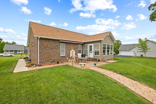 169 Prosperity Dr, Baxter, TN 38544 - back of house with a lawn, a shingled roof, brick siding, and a patio area