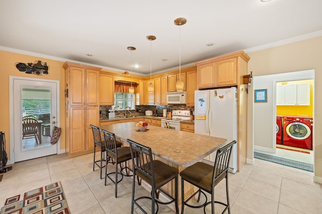169 Prosperity Dr, Baxter, TN 38544 - kitchen with white appliances, independent washer and dryer, ornamental molding, a breakfast bar, and tasteful backsplash
