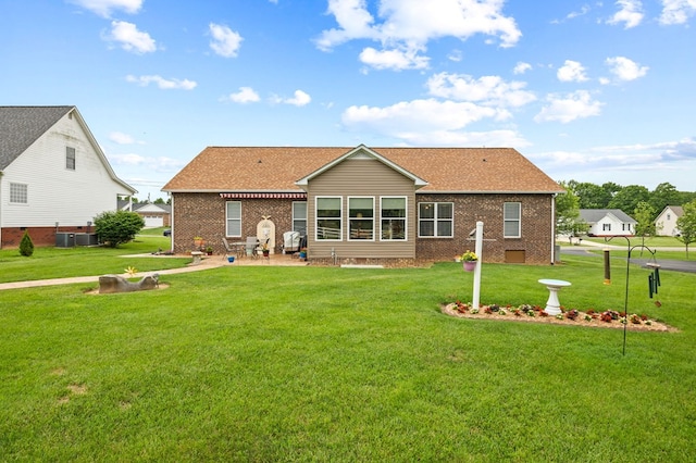 169 Prosperity Dr, Baxter, TN 38544 - back of house with a yard, brick siding, a patio, and cooling unit