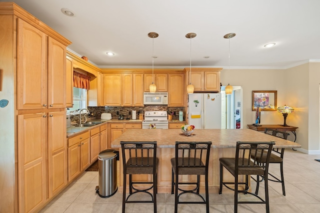 169 Prosperity Dr, Baxter, TN 38544 - kitchen with white appliances, a sink, a breakfast bar, a center island, and ornamental molding