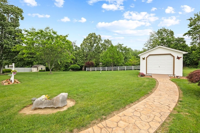 169 Prosperity Dr, Baxter, TN 38544 - view of yard featuring an outbuilding, a detached garage, and view of scattered trees