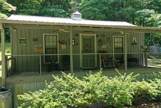 190 Roughshod Ln, Hilham, TN 38568 - view of front facade with board and batten siding, ceiling fan, a porch, and a metal roof