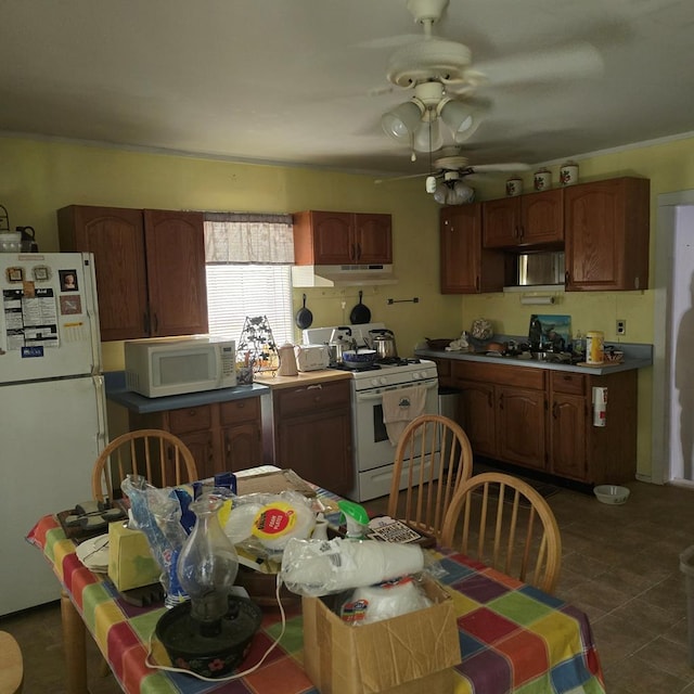 190 Roughshod Ln, Hilham, TN 38568 - kitchen with white appliances, ceiling fan, under cabinet range hood, and dark tile patterned flooring
