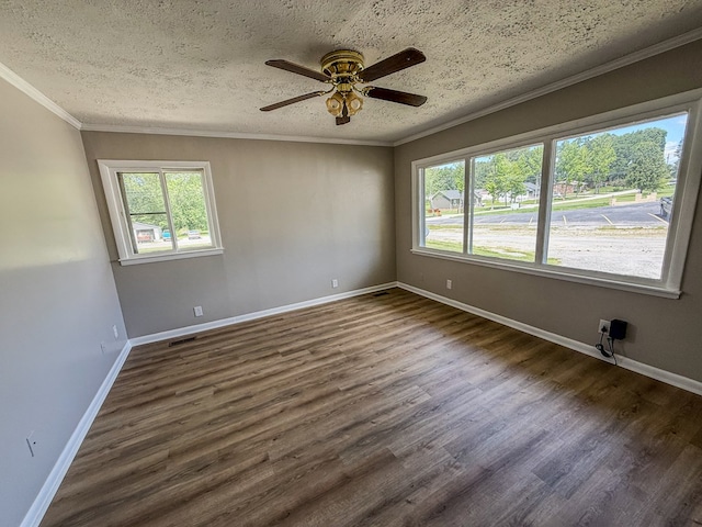 540 4th Ave, Baxter, TN 38544 - empty room with dark wood-style flooring, ceiling fan, ornamental molding, and a textured ceiling