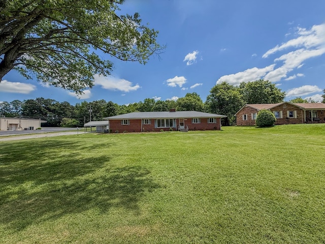 540 4th Ave, Baxter, TN 38544 - single story home featuring a front yard, a chimney, and brick siding