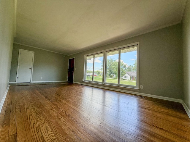 540 4th Ave, Baxter, TN 38544 - spare room featuring wood finished floors and crown molding