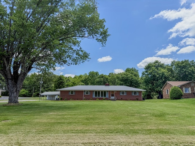 540 4th Ave, Baxter, TN 38544 - single story home with a front yard, a chimney, and brick siding