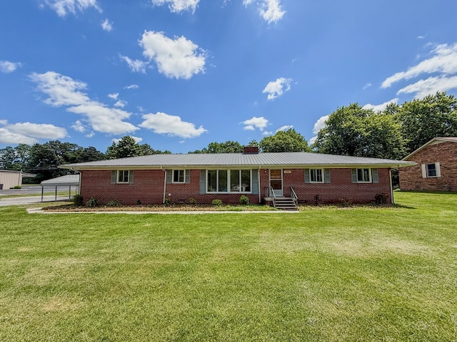 540 4th Ave, Baxter, TN 38544 - ranch-style home with brick siding, a front yard, and a metal roof