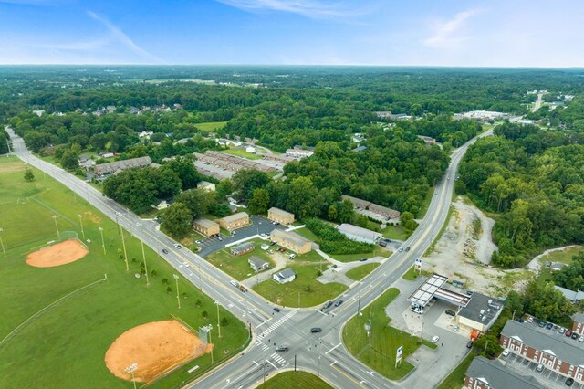 bird's eye view featuring a wooded view