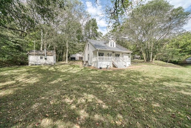 exterior space with a porch, a front yard, an outbuilding, and a storage unit