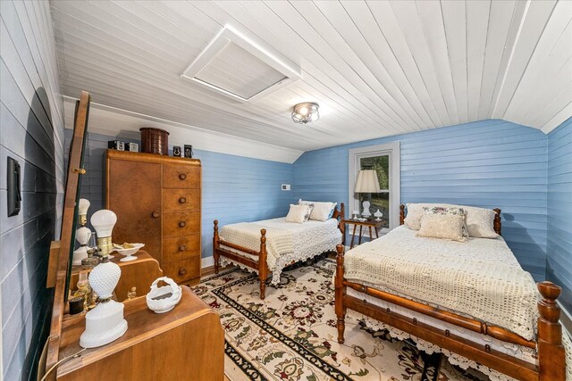 bedroom featuring lofted ceiling and wood ceiling