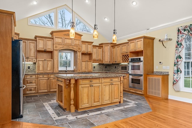 kitchen featuring tasteful backsplash, dark wood-style flooring, a center island, stainless steel appliances, and pendant lighting