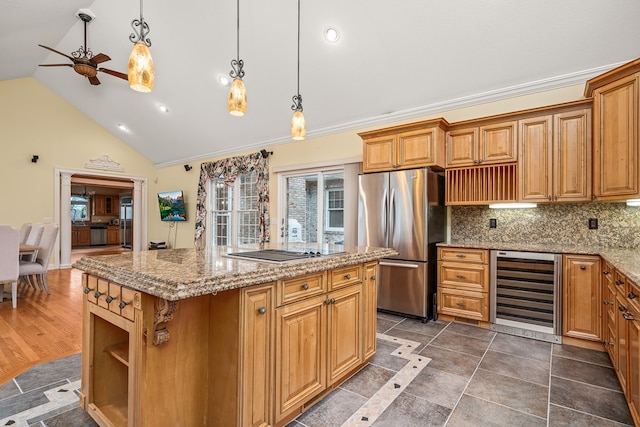 kitchen with open shelves, a center island, beverage cooler, and freestanding refrigerator