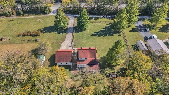 birds eye view of property with a rural view