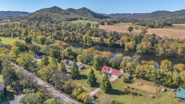 drone / aerial view featuring a water and mountain view