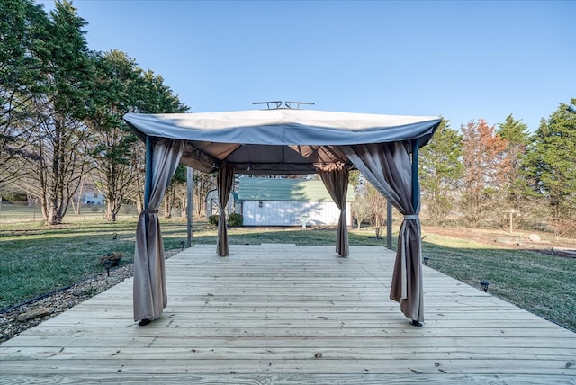 view of home's community featuring a lawn, a deck, and a gazebo