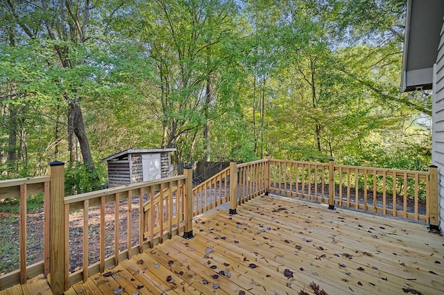 deck featuring a storage unit and an outdoor structure