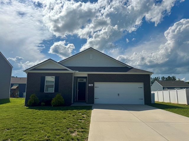 336 Oliver Way, Baxter, TN 38544 - view of front of home with concrete driveway, a garage, and brick siding